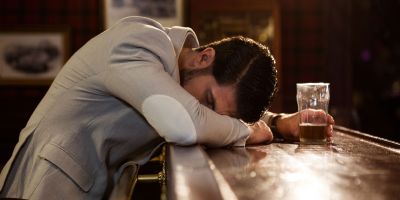 A man suffers from alcoholism and sleep disorders.