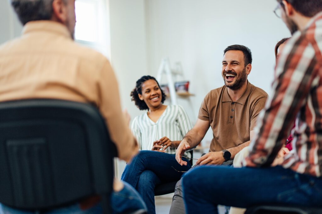 A group of people enjoy Columbus Georgia Drug and Alcohol Addiction Treatment Resources group therapy.