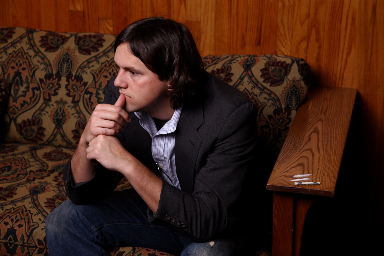 man sitting on the couch wondering what does cocaine do to your body